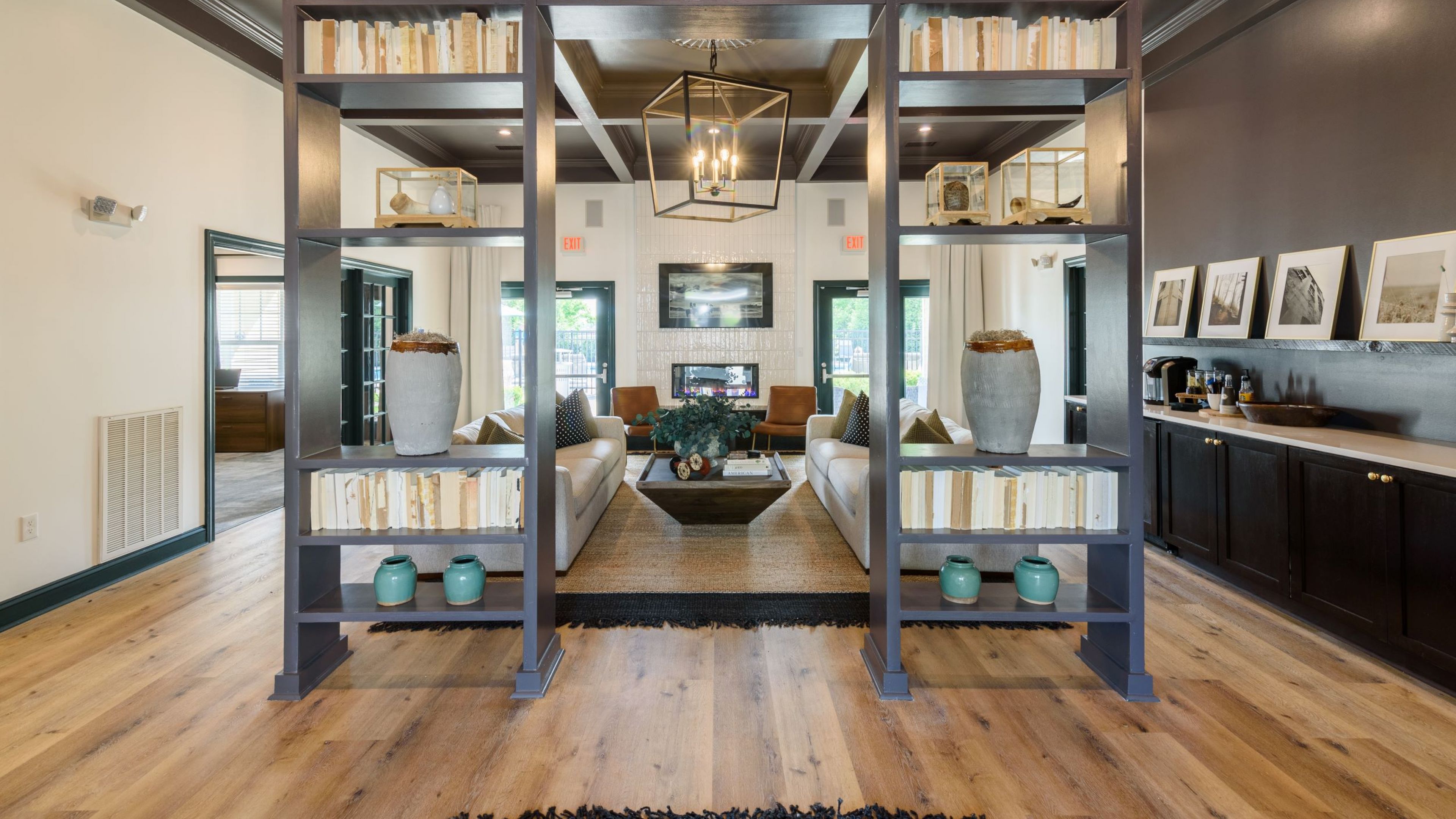 Hawthorne at the Hollow resident clubhouse amenity with bookcase, seating area and beautiful finishes