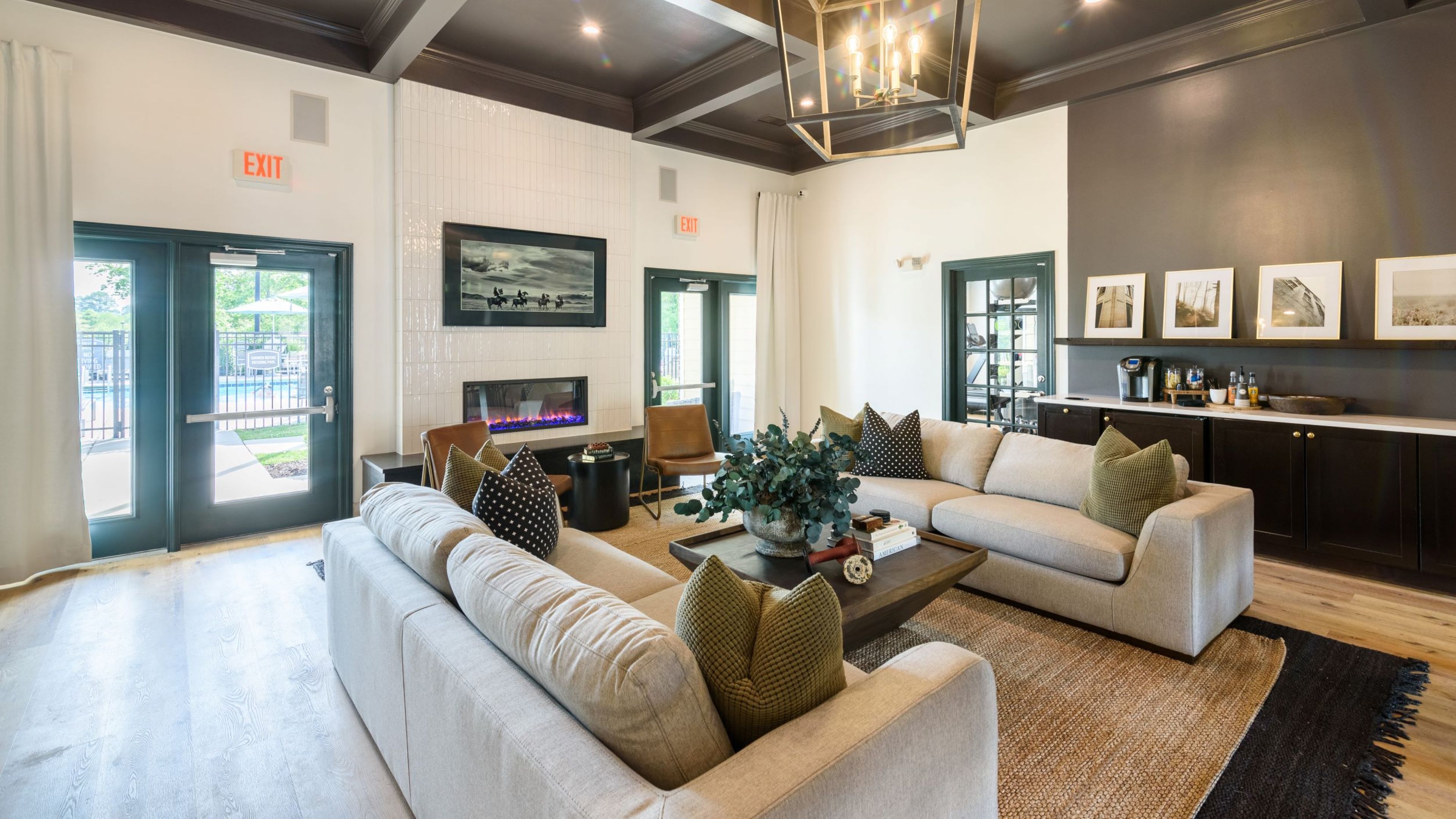 Hawthorne at the Hollow resident clubhouse amenity with seating area and beautiful finishes
